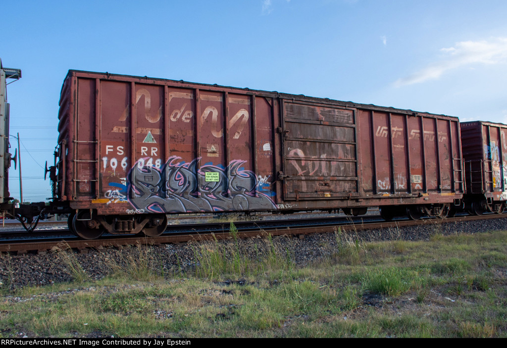 A former NdeM Boxcar rolls east through Rosenberg